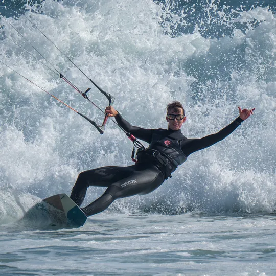 Lars kitesurfing in breaking surf